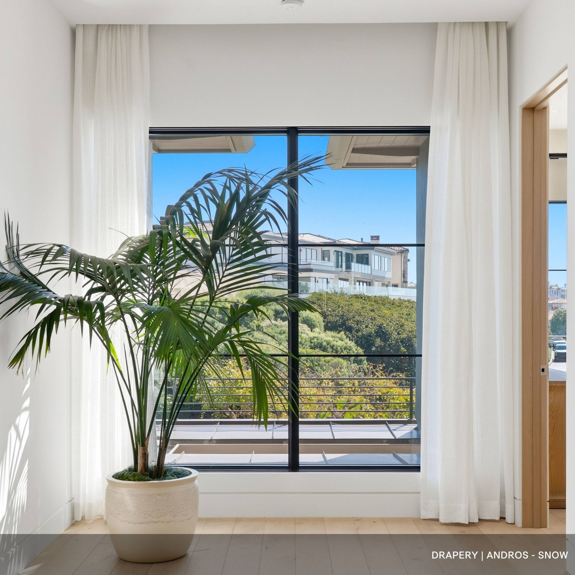 Split draw Drapery of white fabric