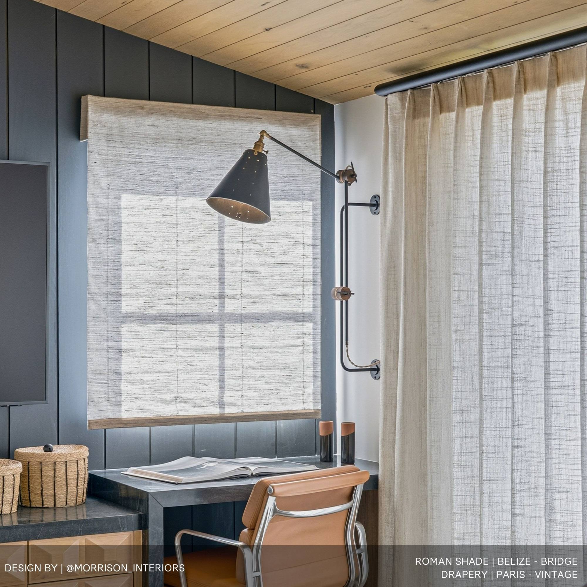 Close up of roman shade and drapery fabric